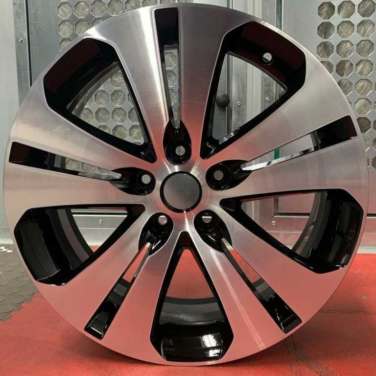 A shiny alloy wheel after the diamond cut alloy refurbishment process